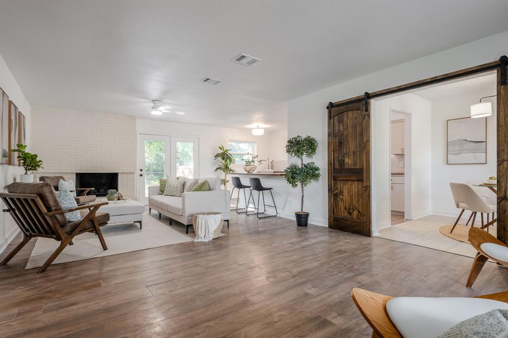 1807 North Waterview Drive Richardson, TX 75080 - Photo 3 of 26 a living room with furniture and a wooden floor