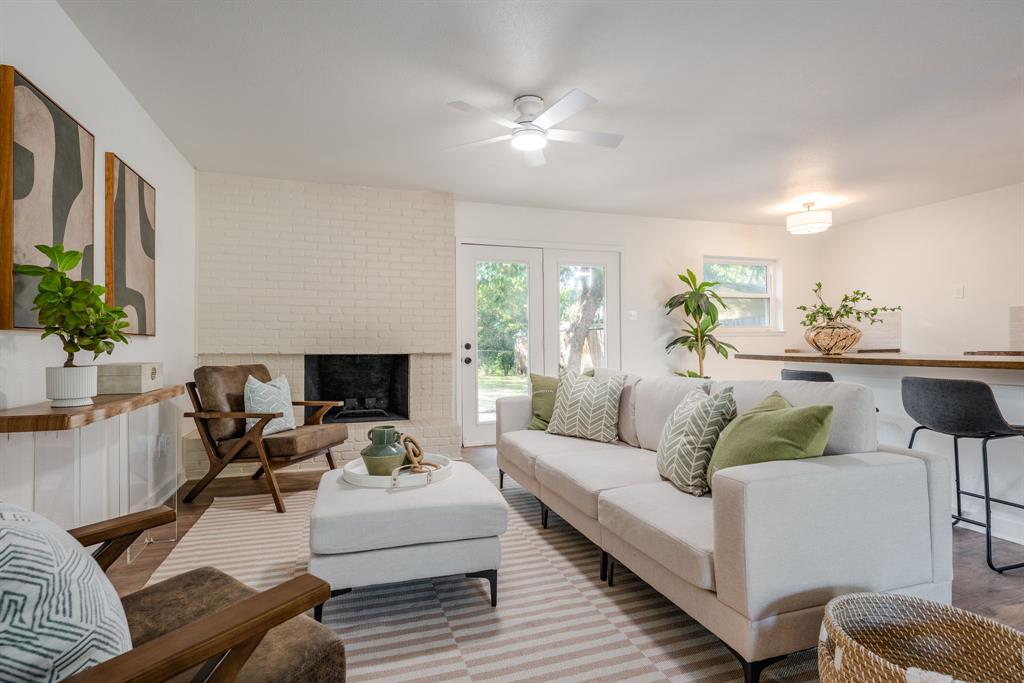 1807 North Waterview Drive Richardson, TX 75080 - Photo 6 of 26 a living room with furniture and a fireplace