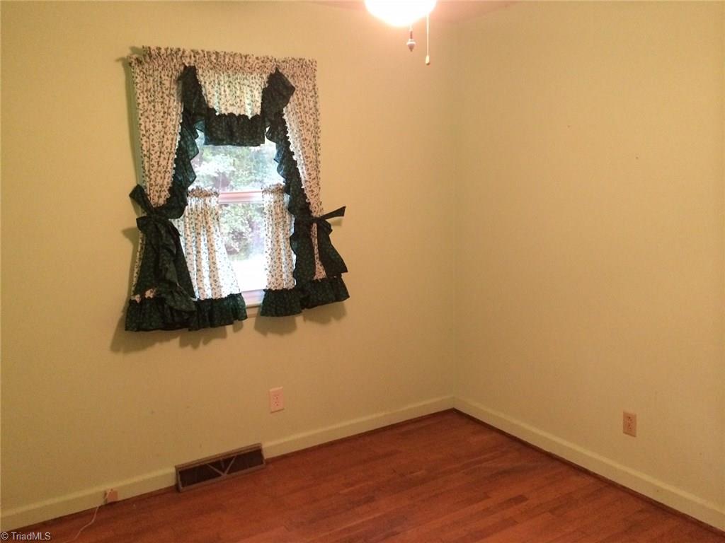 6175 Lanes Mill Road Ramseur, NC 27316 - Photo 8 of 12 Bedroom 2 with hardwood floors!