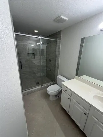 a view of backyard with outdoor seating and green space