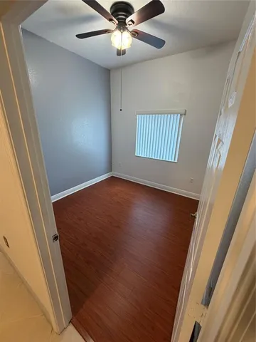 a bathroom with a toilet and a bath tub