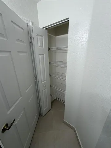 a view of a glass door with a yard