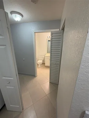 a view of a swimming pool with a yard