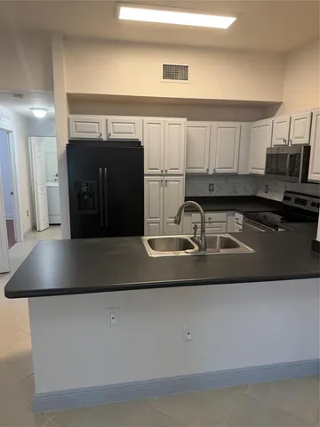 a view of a storage and utility room with a fireplace