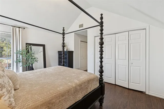 a bedroom with a bed and a dresser