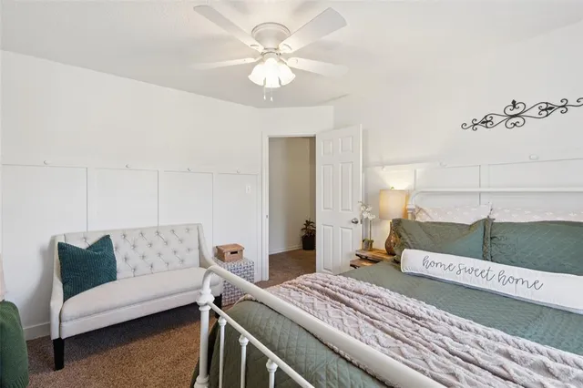 a bedroom with a bed and a couch