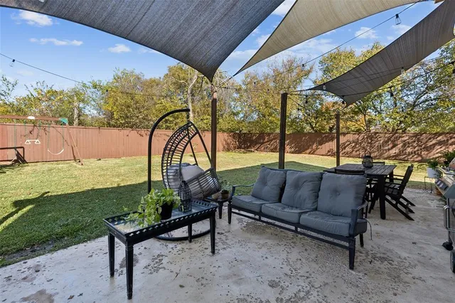 a sitting area with furniture and garden view