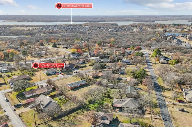 an aerial view of residential building and parking space