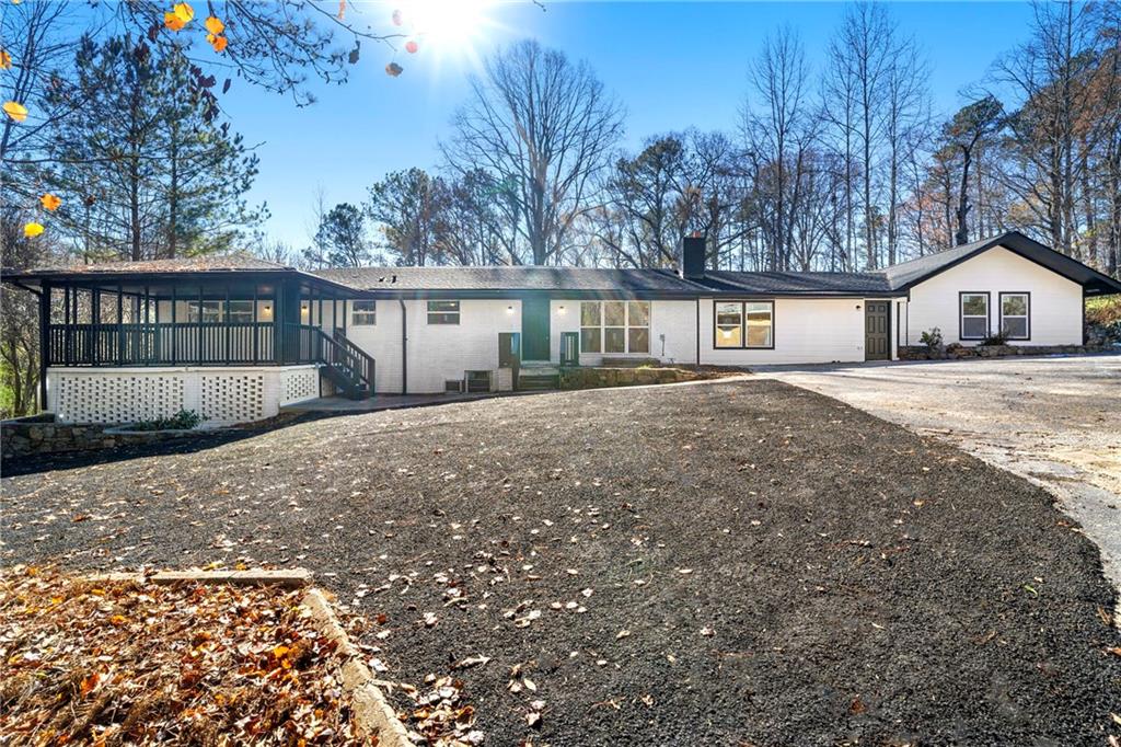 a view of house with a yard