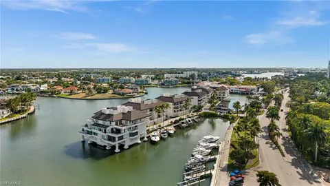 an aerial view of a house with a lake view