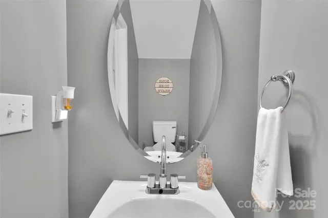 a dining room with table and a chandelier