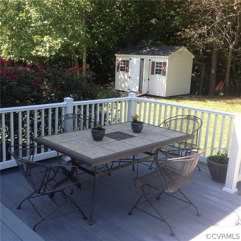 11812 Club Ridge Drive Chester, VA 23836 - Photo 5 of 36 a view of a table and chairs in the balcony