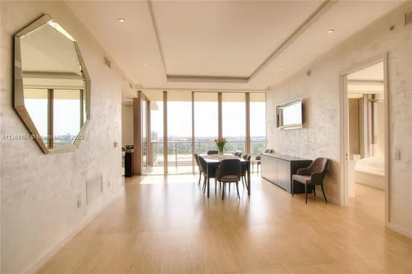 a view of a livingroom with furniture and a window