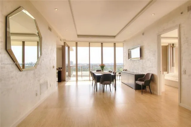 a view of a livingroom with furniture and a window