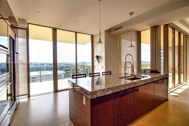 a very nice looking kitchen with a large window