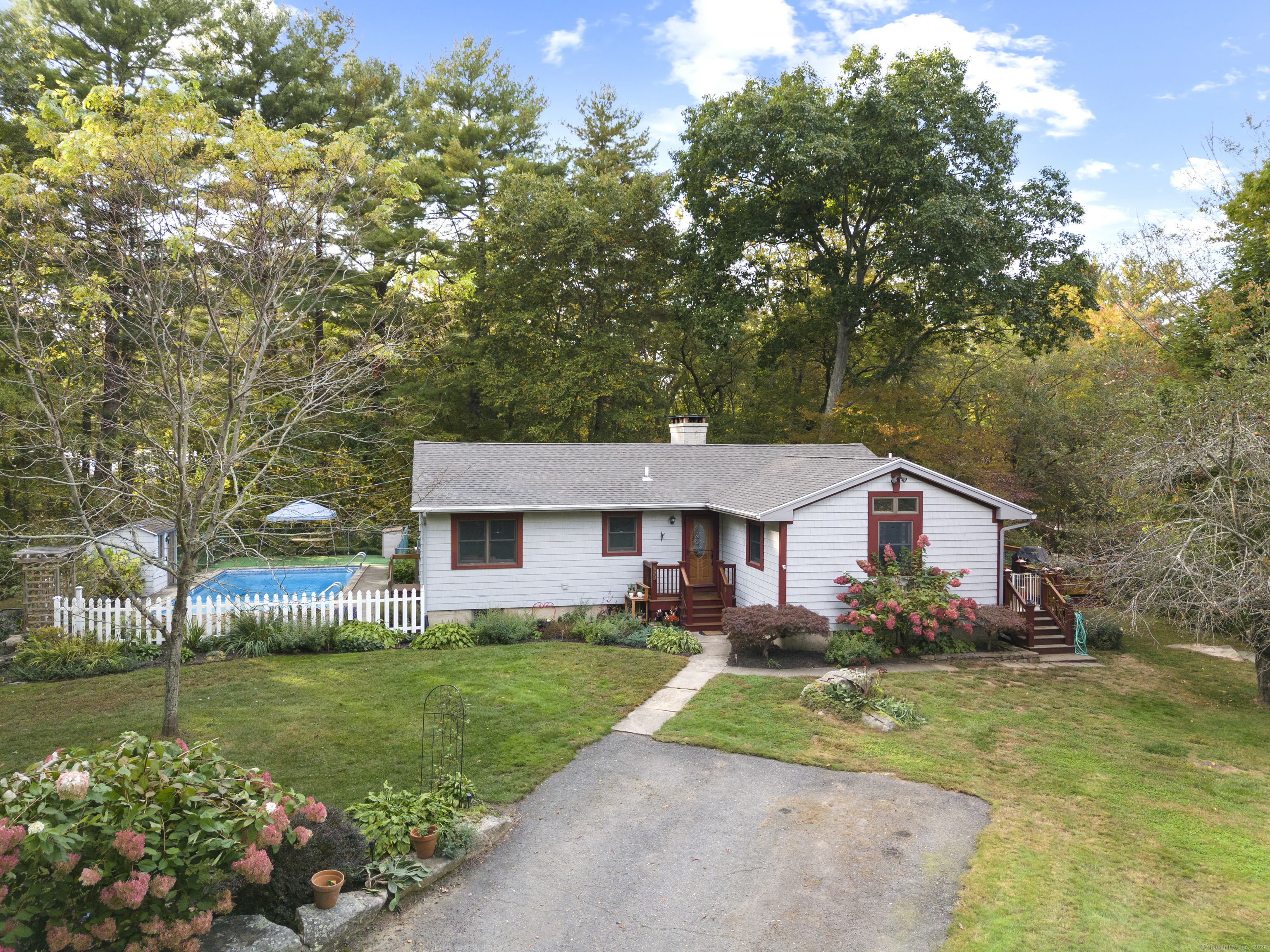 693 Shewville Road Ledyard, CT 06339 - Photo 1 of 1 a front view of house with garden and trees