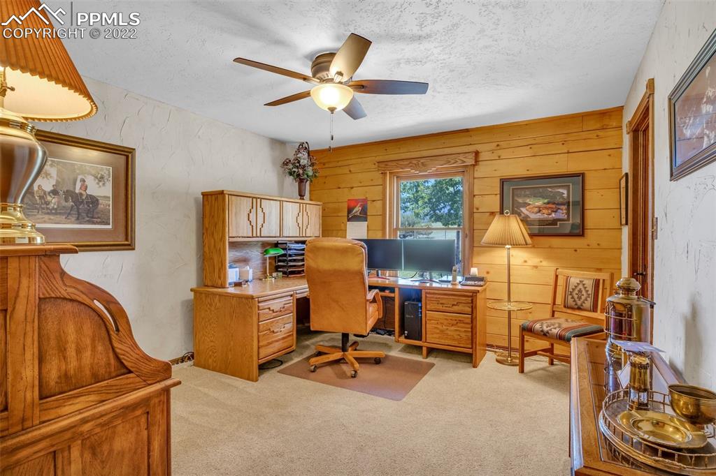 620 Crestview Drive Florence, CO 81226 - Photo 11 of 49 a view of a workspace with furniture and a window
