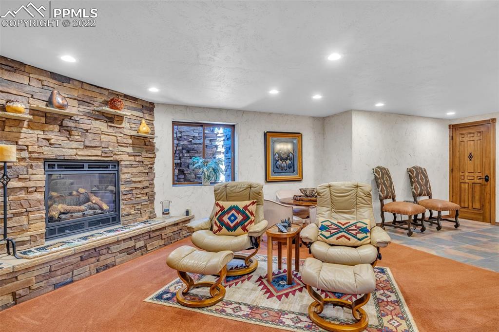 620 Crestview Drive Florence, CO 81226 - Photo 34 of 49 a living room with furniture and a fireplace