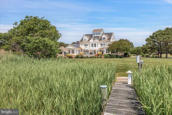 a kitchen with stainless steel appliances granite countertop a stove a refrigerator and a sink