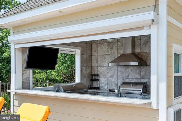 a bathroom with a sink vanity mirror and toilet