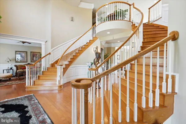 a front view of a house with a yard and potted plants