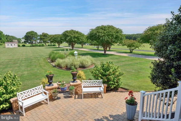 a living room with a fireplace and a floor to ceiling window