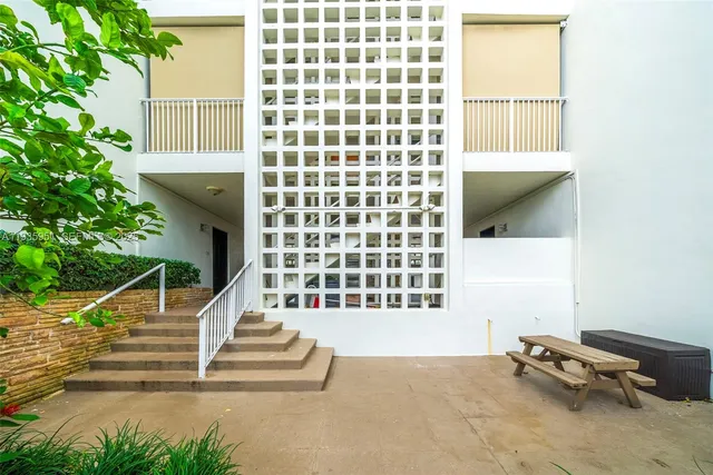 a view of a building with a yard