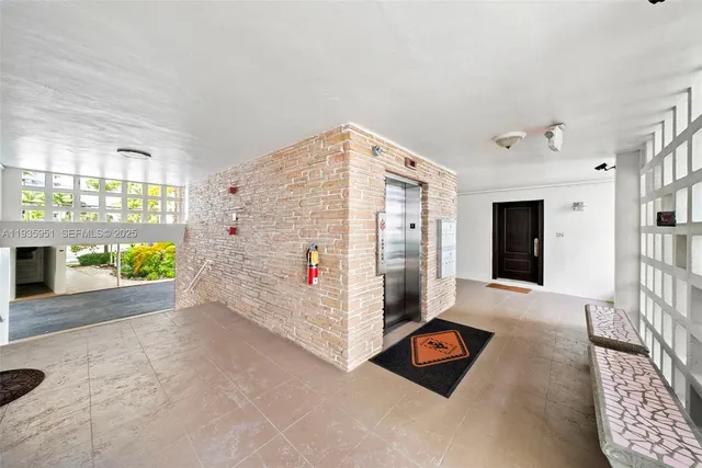 a view of entryway with flower pots