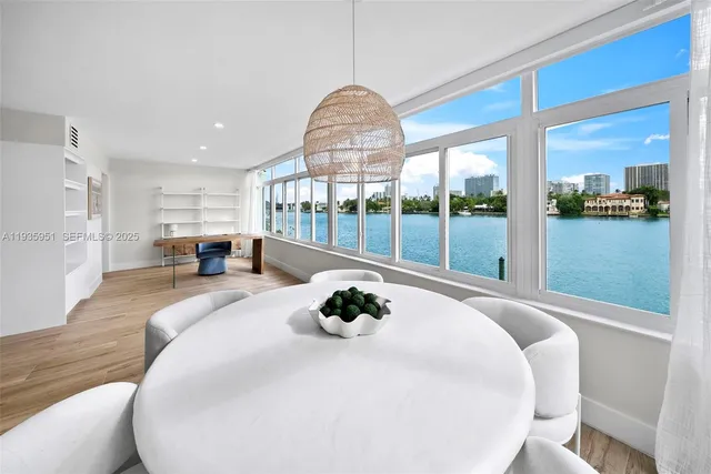 a bedroom with a large bed and a large window