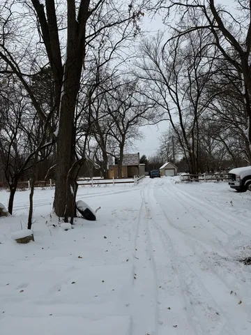 a view of snow on the road