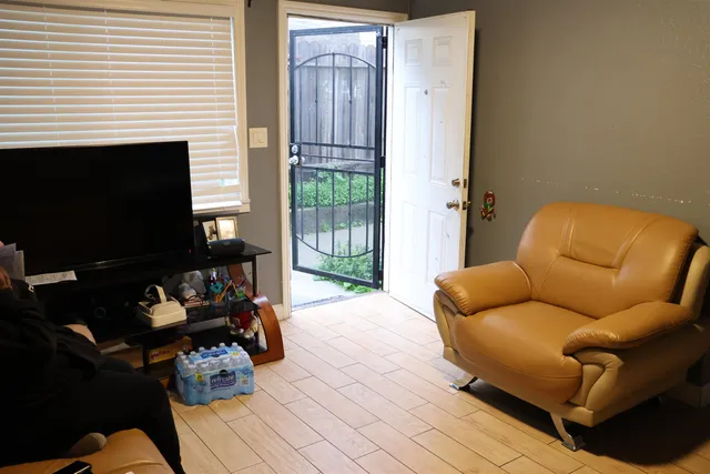 a blue couch sitting in front of a door