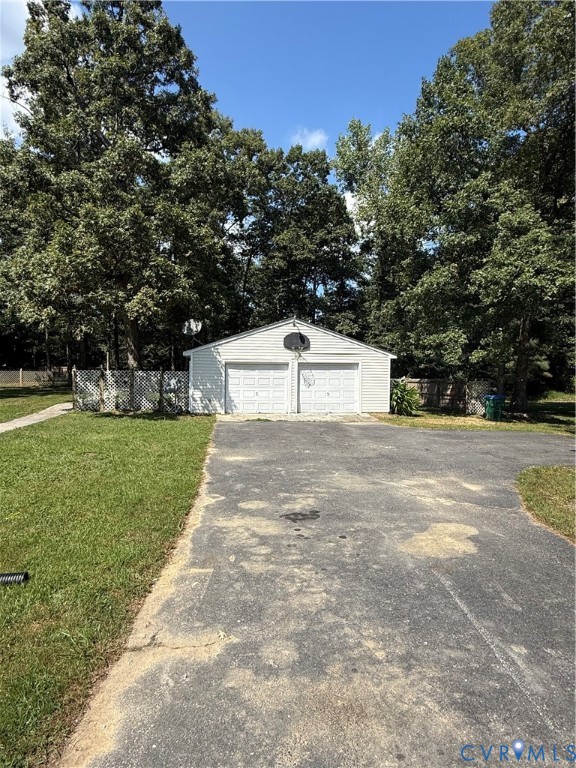 3430 The Loop Road Henrico, VA 23231 - Photo 20 of 27 Detached two-car garage with white siding and a ga