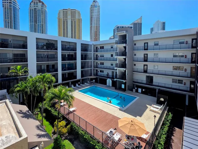 a view of a chairs and table in a patio