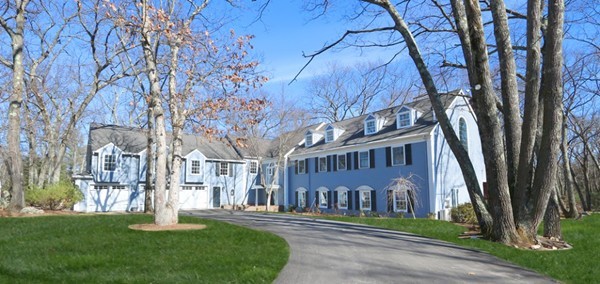 85 Schoolmasters Lane Dedham, MA 02026 - Photo 1 of 30 a view of a big building with a big yard and large trees