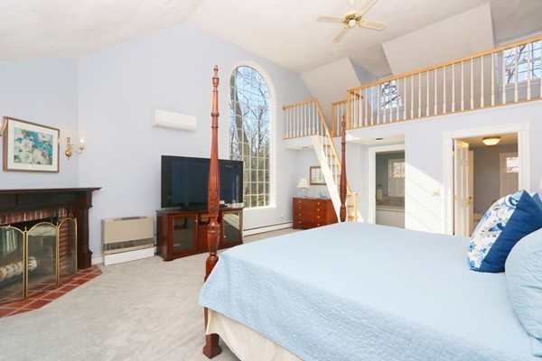 85 Schoolmasters Lane Dedham, MA 02026 - Photo 12 of 30 a bedroom with a bed and a flat screen tv