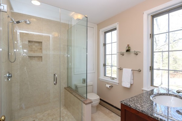 85 Schoolmasters Lane Dedham, MA 02026 - Photo 17 of 30 a bathroom with a granite countertop sink toilet and shower