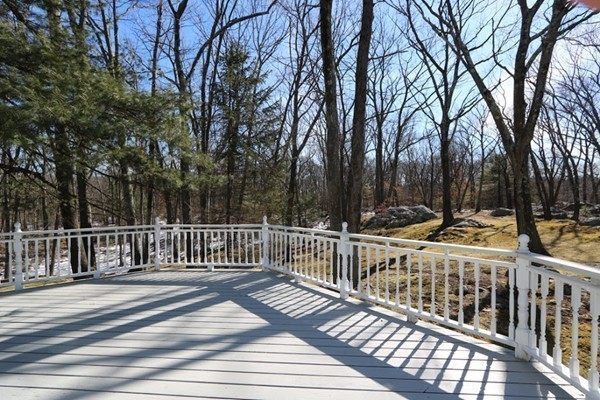 85 Schoolmasters Lane Dedham, MA 02026 - Photo 24 of 30 a view of balcony with wooden fence and trees
