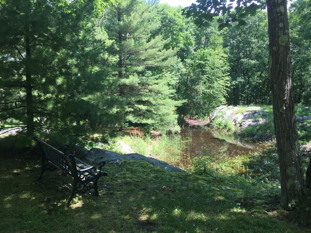 85 Schoolmasters Lane Dedham, MA 02026 - Photo 28 of 30 a backyard of a house with lots of green space