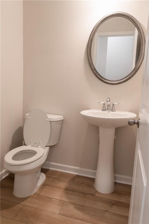 4545 Ajo Walk Atlanta, GA 30331 - Photo 13 of 28 a bathroom with a sink toilet and mirror