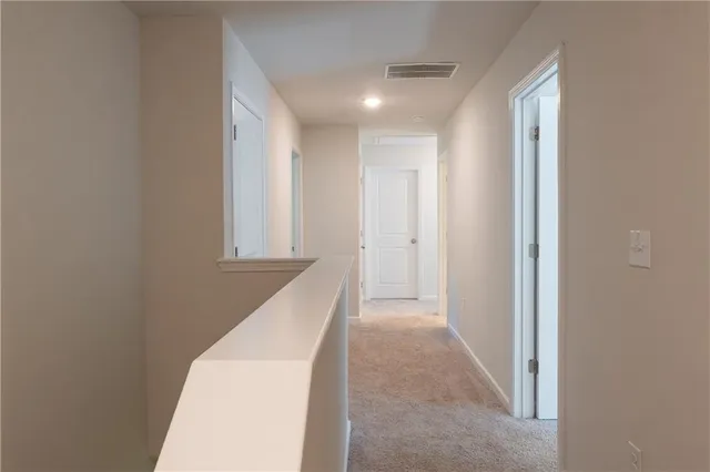 a view of a hallway with entryway