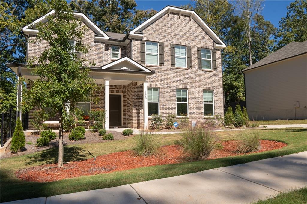 4545 Ajo Walk Atlanta, GA 30331 - Photo 3 of 28 a front view of a house with garden