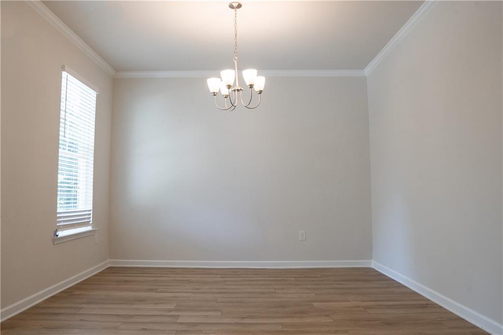 4545 Ajo Walk Atlanta, GA 30331 - Photo 6 of 28 a view of empty room with wooden floor and window