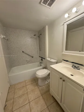 a bathroom with a sink a toilet and a bathtub