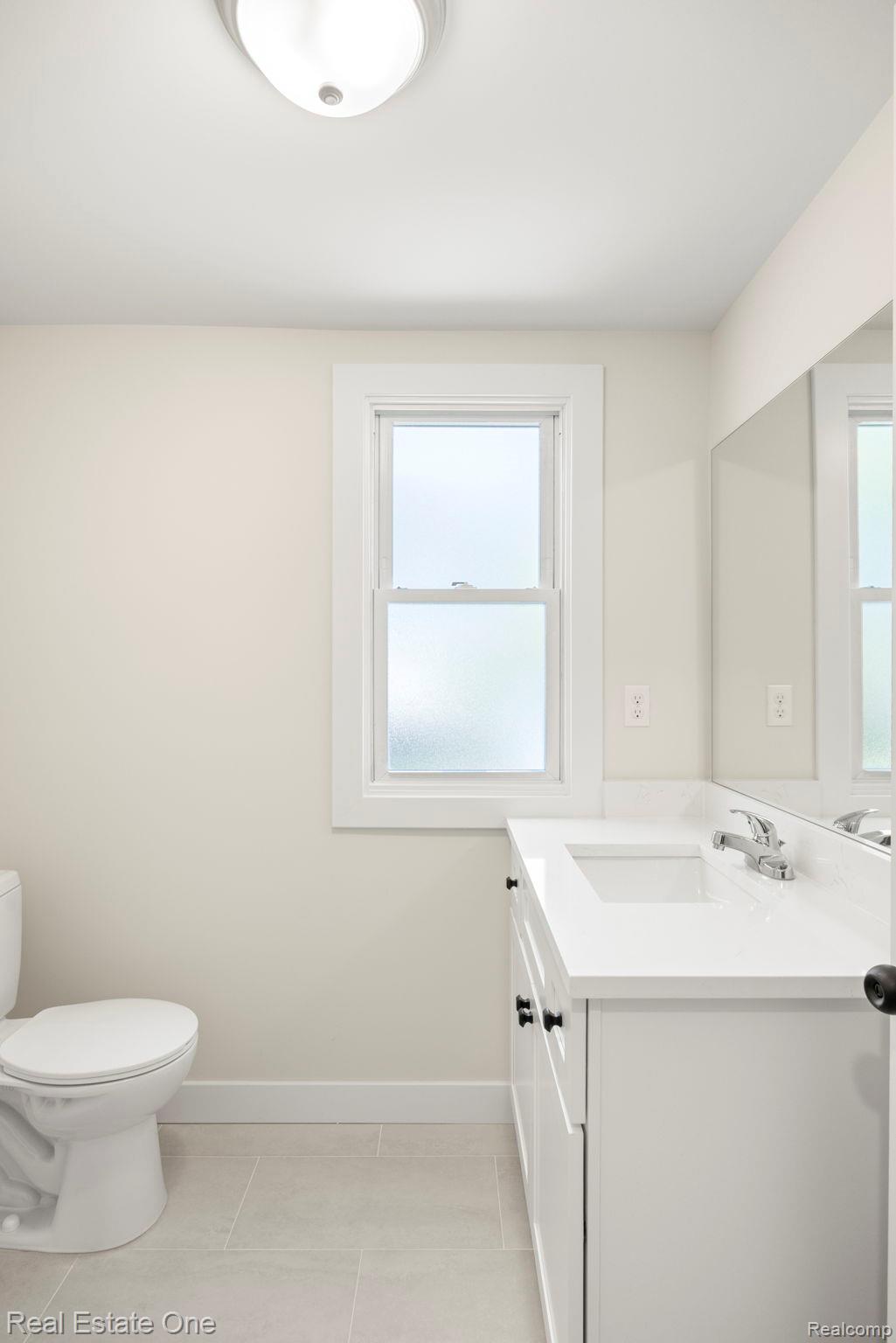 3200 Hessel Avenue Rochester, MI 48307 - Photo 10 of 32 Half bathroom with vanity and light tile patterned floors