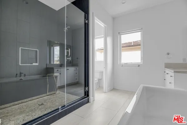 a bathroom with a bathtub and a sink