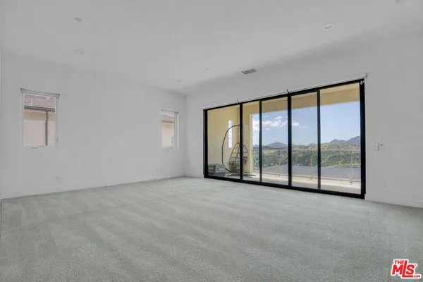 a view of balcony with furniture