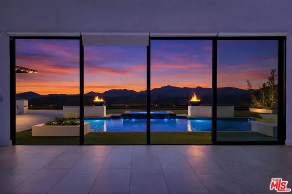 a view of empty room with floor to ceiling window