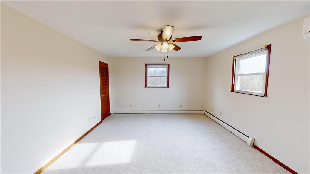 420 Sawmill Run Road Butler, PA 16001 - Photo 24 of 46 an empty room with windows and fan