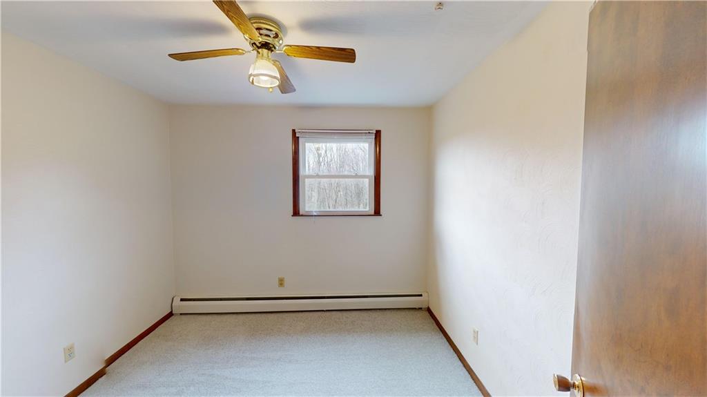 420 Sawmill Run Road Butler, PA 16001 - Photo 28 of 46 an empty room with windows and fan