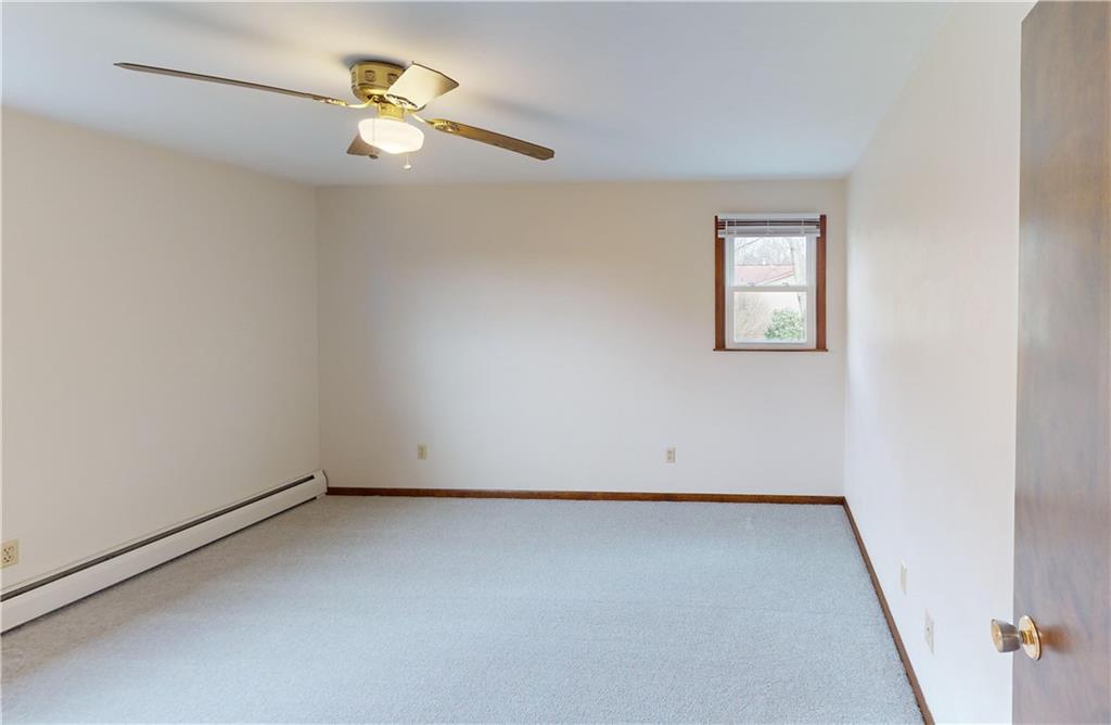 420 Sawmill Run Road Butler, PA 16001 - Photo 31 of 46 an empty room with a window and a ceiling fan